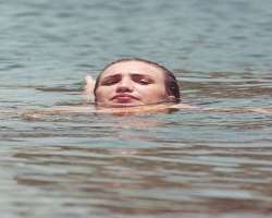 She competed at the state and national level as a swimmer but unfortunately, her shoulder injury forced her to stop swimming.